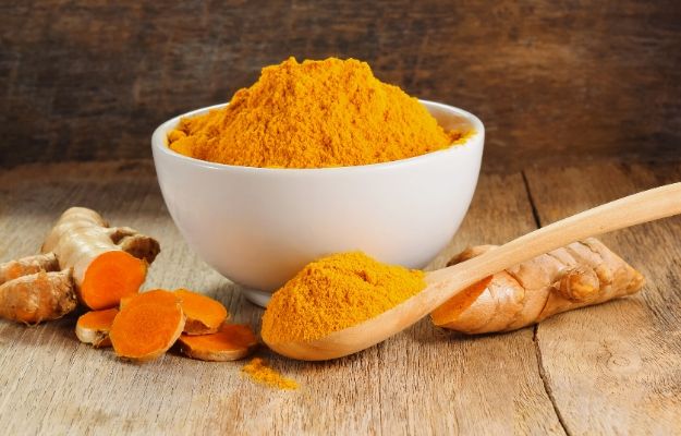 Turmeric and Turmeric power with wooden spoon | Turmeric | 12 Best Anti-Aging Foods For Gut Health